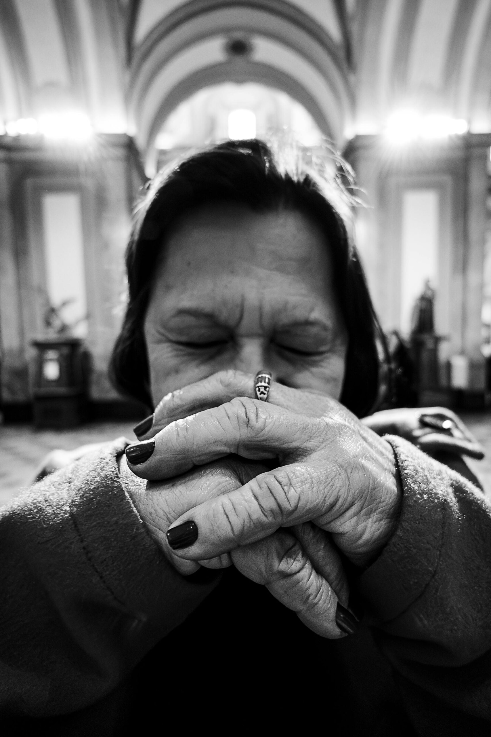 Elderly woman praying